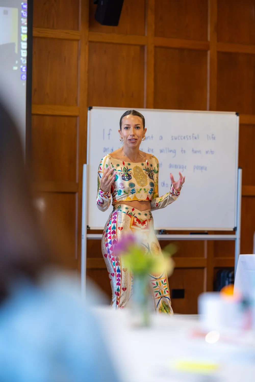 Tracy Harris teaching at the front of a room